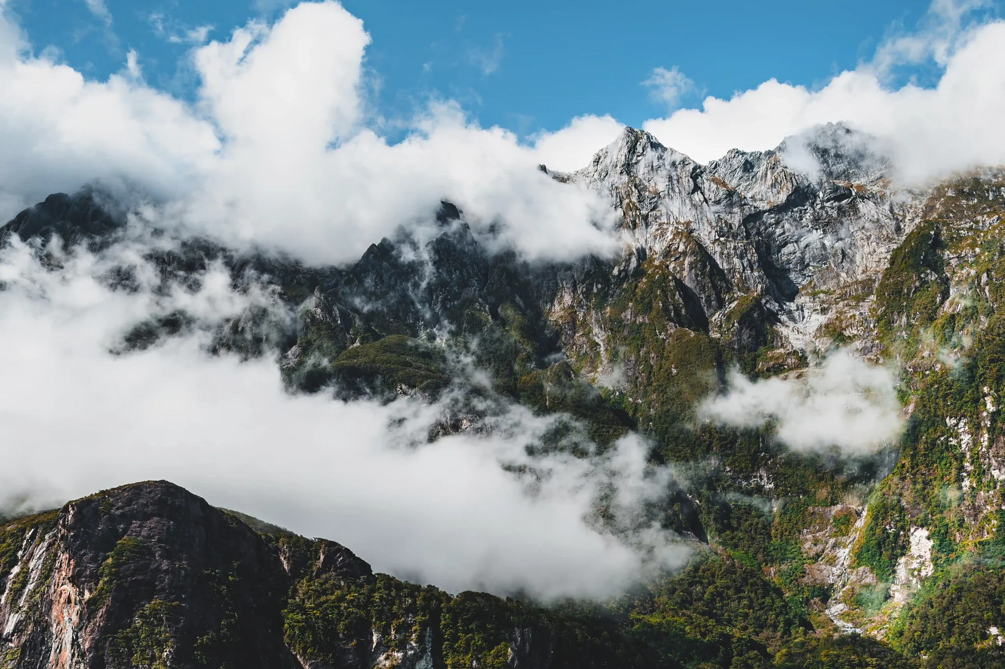 Sharp peaks. Soft clouds.